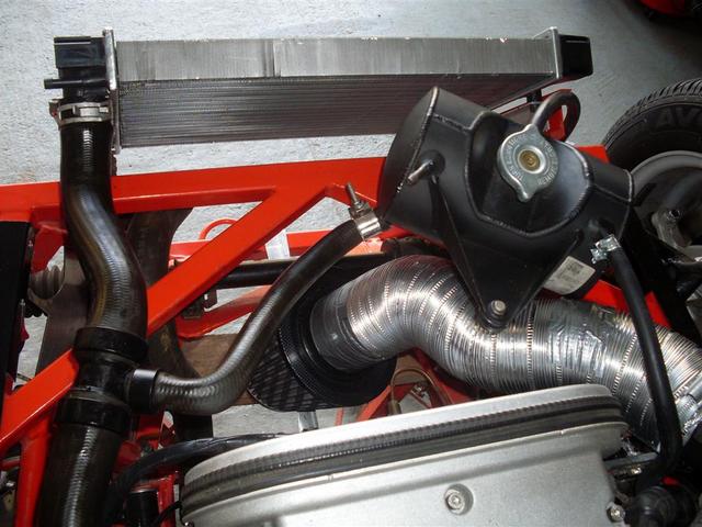 air inlet flexible (ripspeed). Attempt to pull cold air from below the radiator!